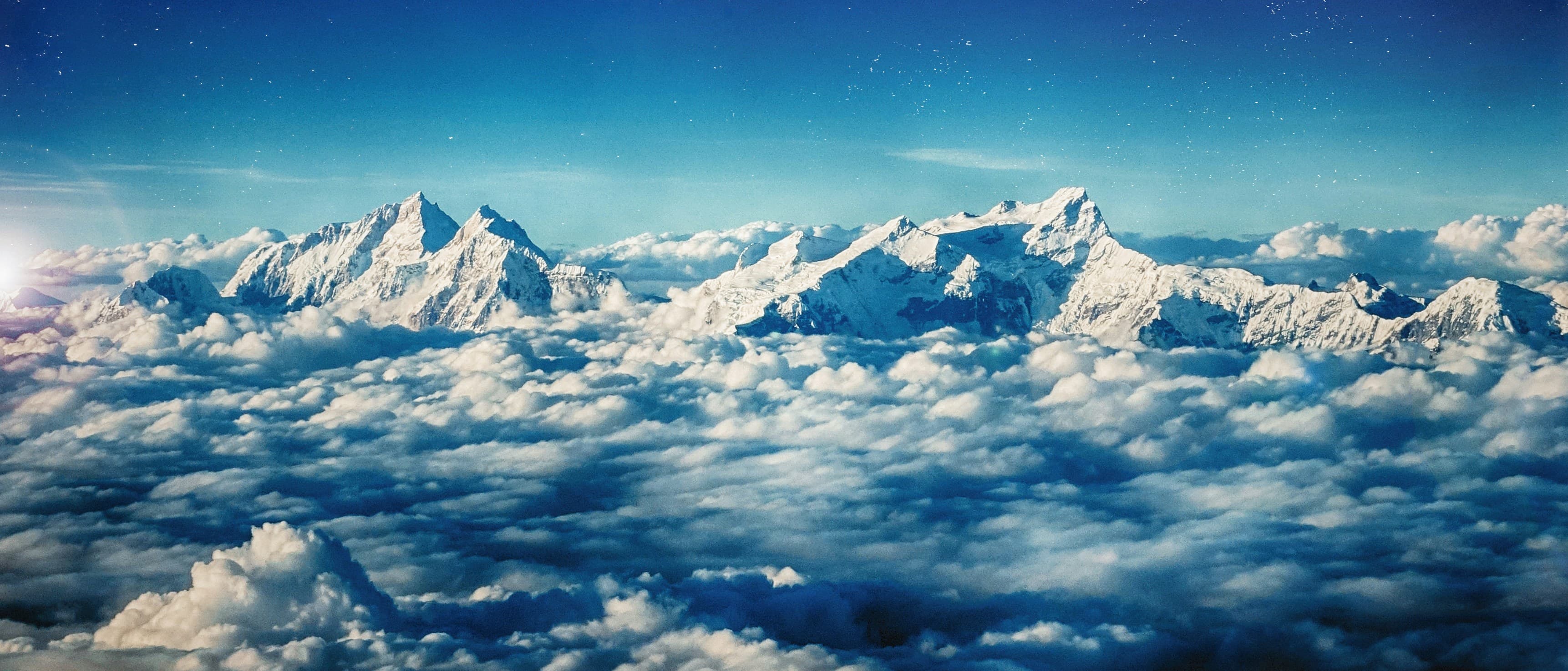A high mountain landscape beneath a bright Himalayan sky